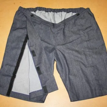 Grey shorts showing velcro side leg fastening